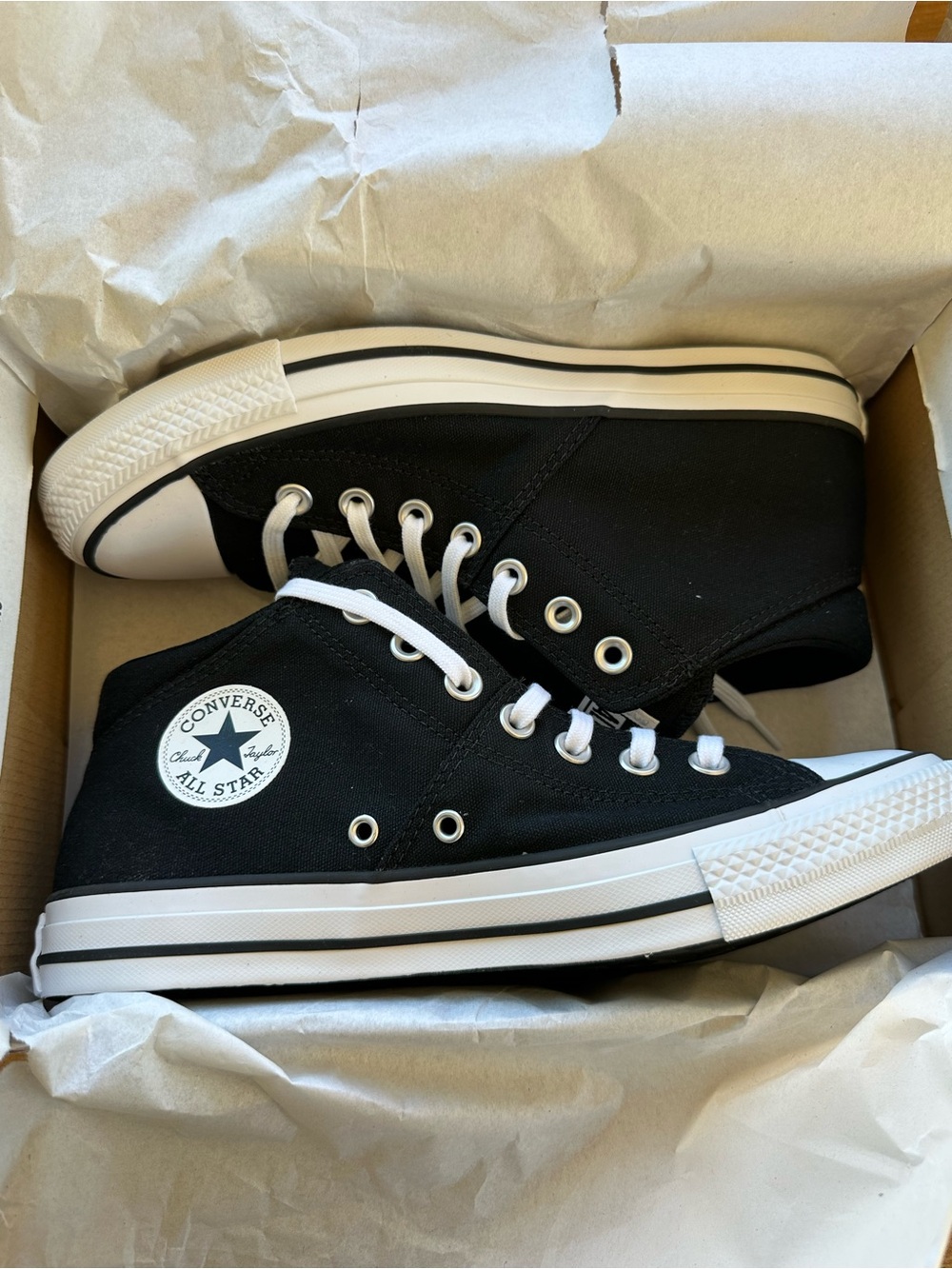 Converse women’s Black mid High-Top Sneakers with White Trim